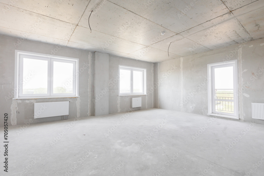 Fototapeta premium interior of the apartment without decoration in gray colors. rough finish