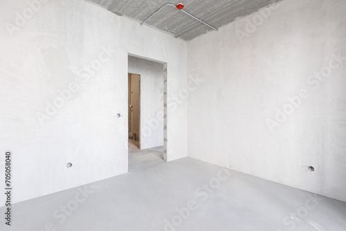 interior of the apartment without decoration in gray colors. rough finish