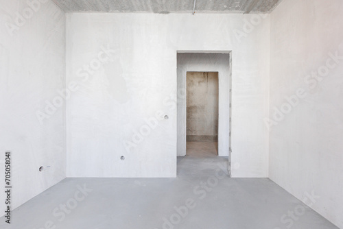 interior of the apartment without decoration in gray colors. rough finish