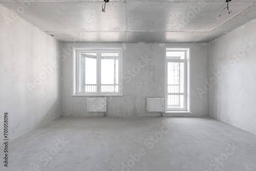 interior of the apartment without decoration in gray colors. rough finish
