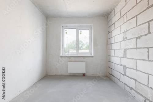 interior of the apartment without decoration in gray colors. rough finish