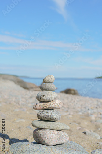 Stacked Rocks balancing  stacking with precision. Stone tower on the shore. Copy space