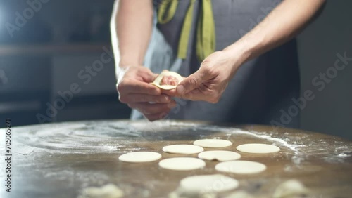 man making homemade meat dumplings  photo