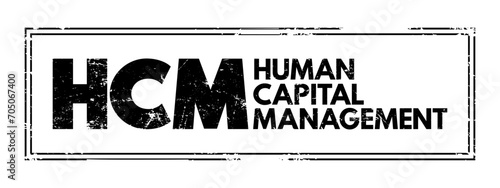 HCM - Human Capital Management is the process of hiring the right people, managing workforces effectively and optimizing productivity, acronym business concept stamp