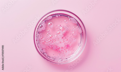 violet  serum droplets in petri dish photo