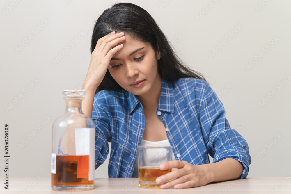 depression and anxiety woman drinking whisky alone. depression and anxiety woman drinking whisky alone.