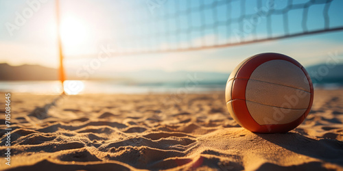 Sunlit volleyball ready for play on sandy beach grounds, with a net in the backdrop photo