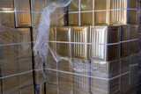 olive oil tins stored in groups to be used in packaging industry for oils and liquids
