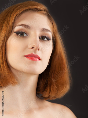 Beautiful young woman with red hair