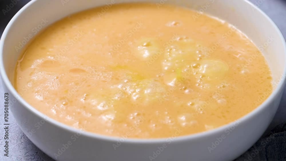 Cooking pastry dessert. Adding orange fruit juice to egg mixture, baking orange sponge cake Cooking pastry dessert. Adding orange fruit juice to egg mixture, baking orange sponge cake