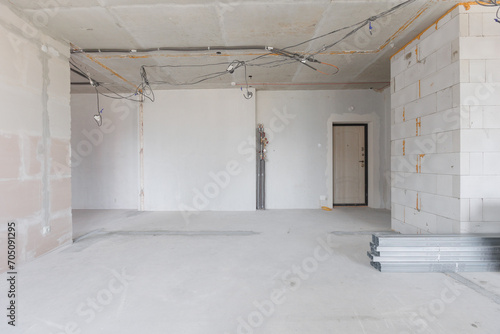 interior of the apartment without decoration in gray colors. rough finish