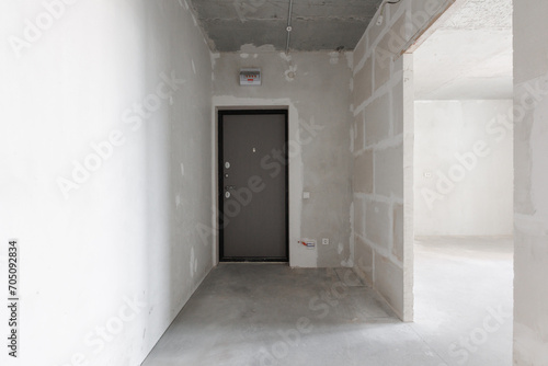 interior of the apartment without decoration in gray colors. rough finish