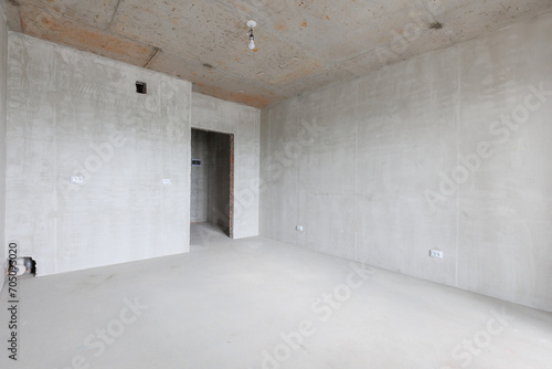 interior of the apartment without decoration in gray colors. rough finish