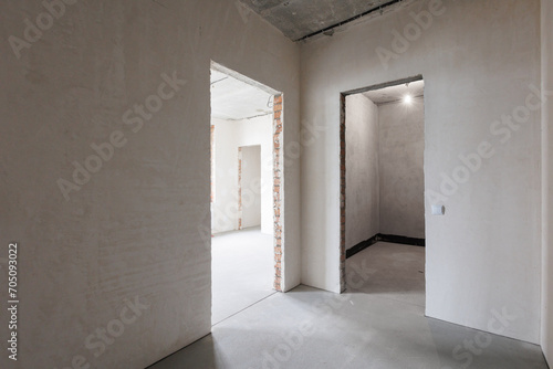 interior of the apartment without decoration in gray colors. rough finish