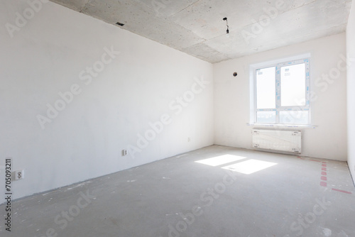 interior of the apartment without decoration in gray colors. rough finish