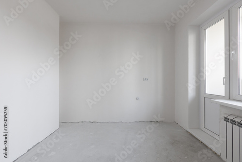 interior of the apartment without decoration in gray colors. rough finish