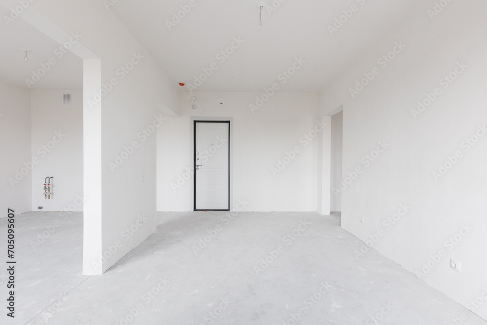 Fototapeta premium interior of the apartment without decoration in gray colors. rough finish