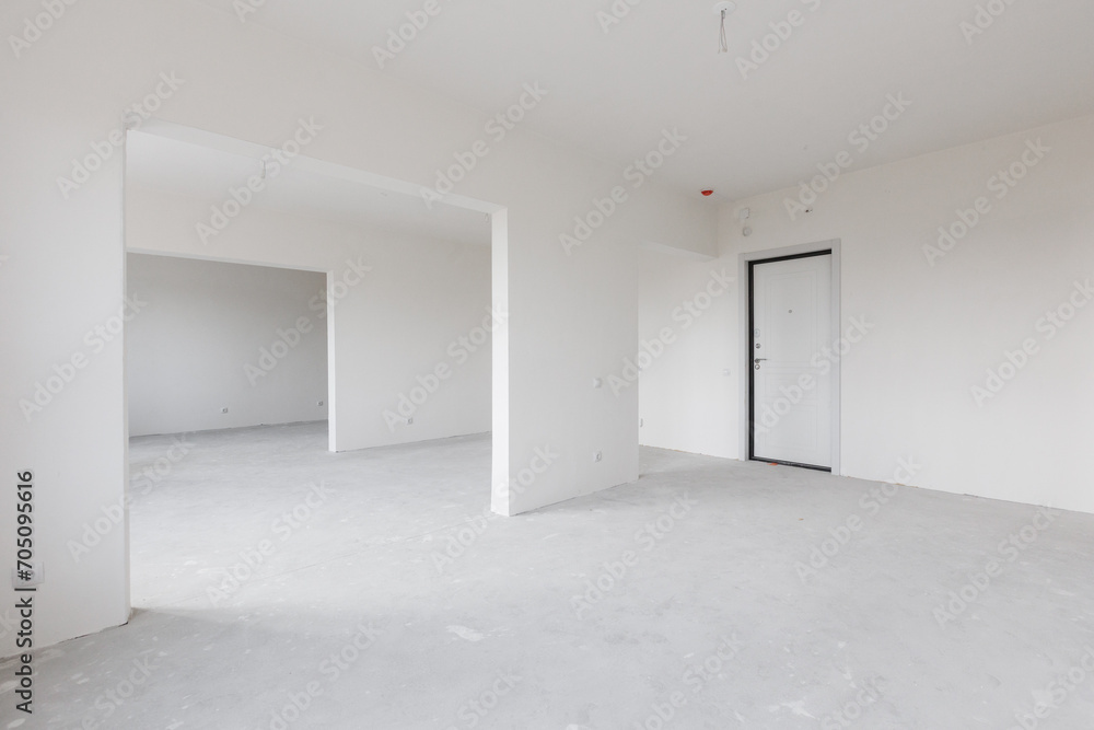 Fototapeta premium interior of the apartment without decoration in gray colors. rough finish