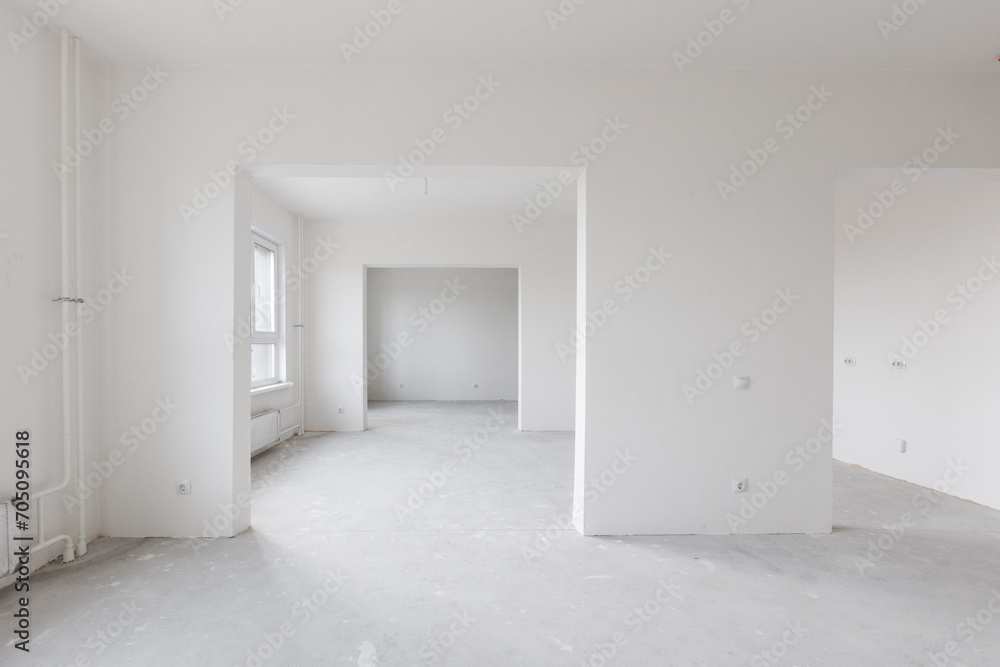 Fototapeta premium interior of the apartment without decoration in gray colors. rough finish