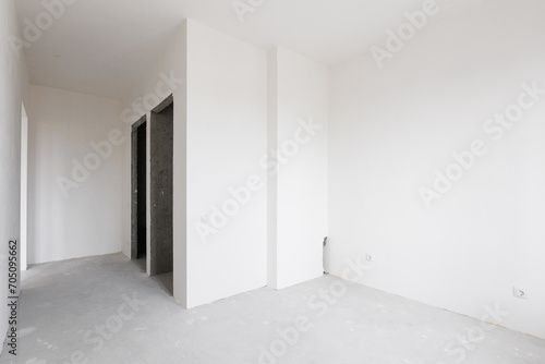 interior of the apartment without decoration in gray colors. rough finish