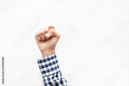 Mano o puño cerrado de un hombre caucásico y delgado sobre un fondo blanco aislado  photo