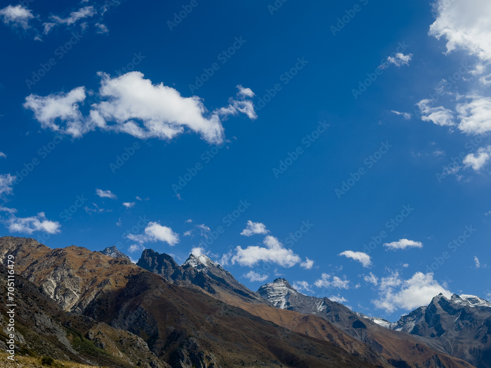 Landscape in the mountains with blue sky and clouds on a bright day