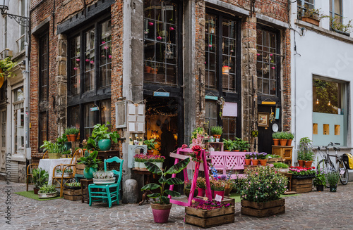 Old street with flower shop in historic city center of Antwerpen (Antwerp), Belgium. Cozy cityscape of Antwerp. Architecture and landmark of Antwerpen