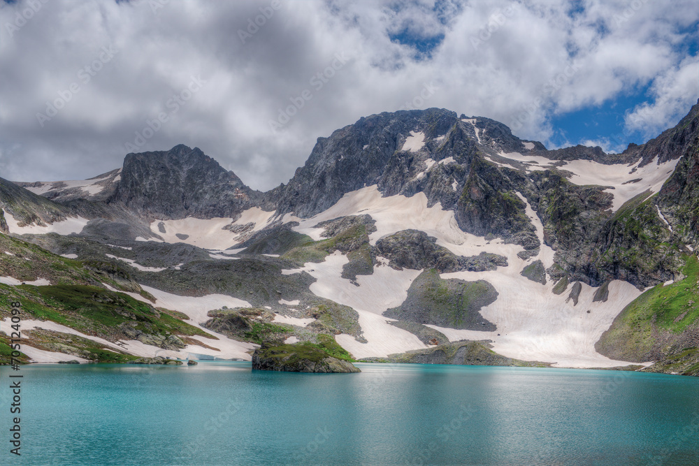 Lake against the backdrop of a mountain range.