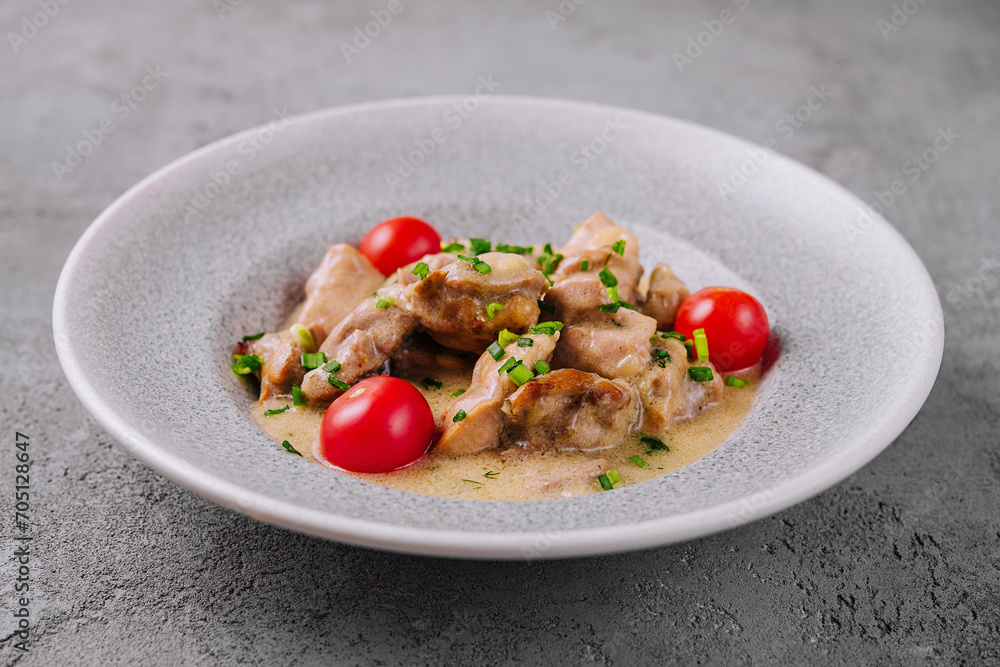 Grilled chicken breast with cream sauce and tomatoes Grilled chicken breast with cream sauce and tomatoes