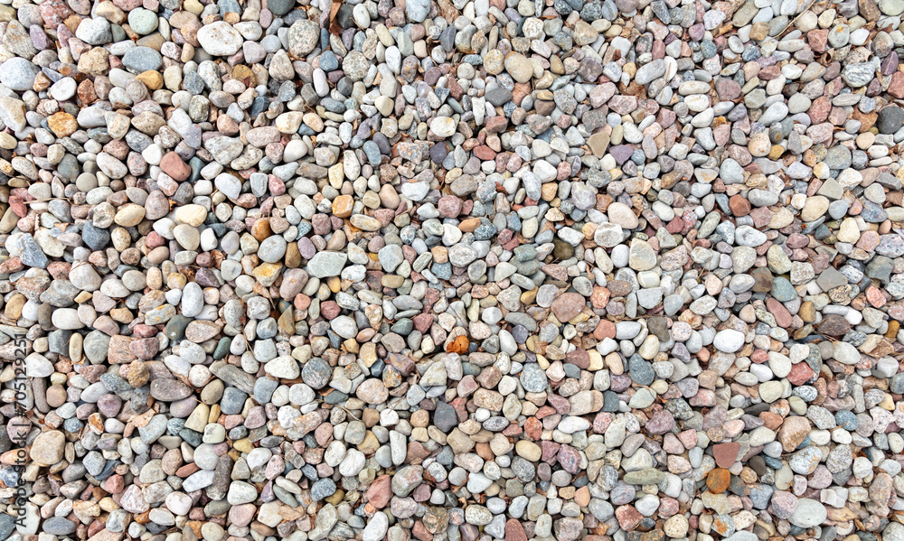 Vibrant mosaic of river stones in various hues, a natural texture perfect for backgrounds, designs, and earthy concepts with a touch of colorful randomness Vibrant mosaic of river stones in various hues, a natural texture perfect for backgrounds, designs, and earthy concepts with a touch of colorful randomness
