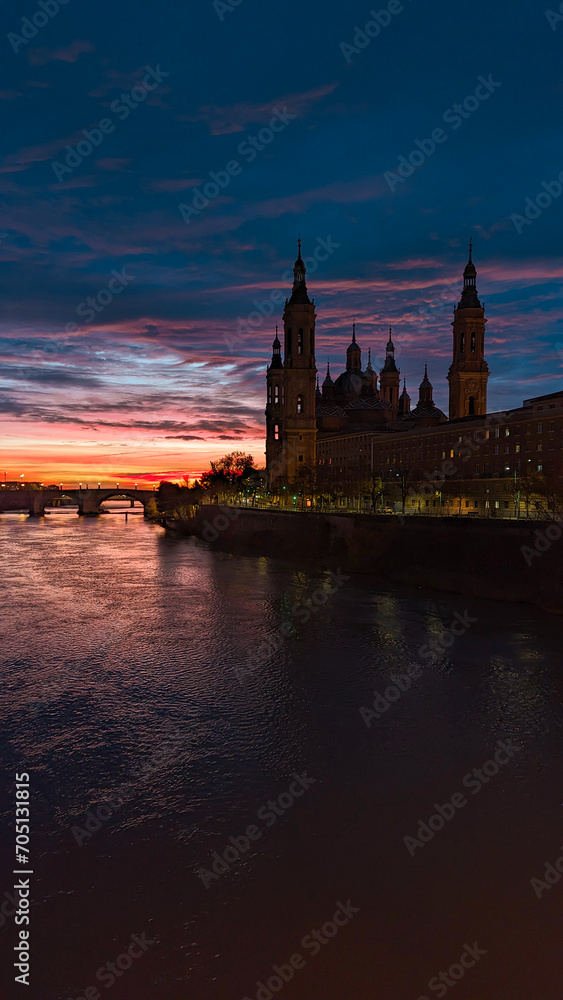 Zaragoza Awakens: The Warm Embrace of the Sun between the Basilica del Pilar and the Ebro River
