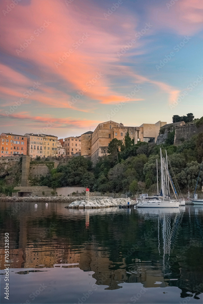 Fototapeta premium Corsica, Bastia, typical houses in the harbor in summer, sunset 