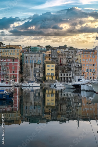Corsica, Bastia, typical houses in the harbor in summer, sunset 
