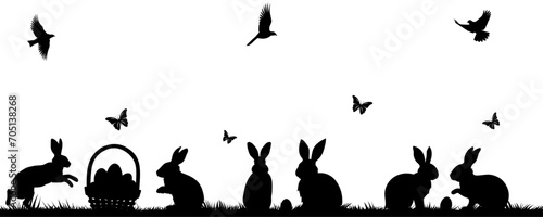 Silhouettes of Easter bunnies, butterflies, birds and a basket of eggs on the grass. Vector of different rabbit silhouettes for design. Easter and bunny.