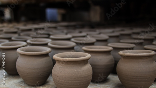 Pottery making involves shaping clay by hand, using a wheel, or coiling techniques.