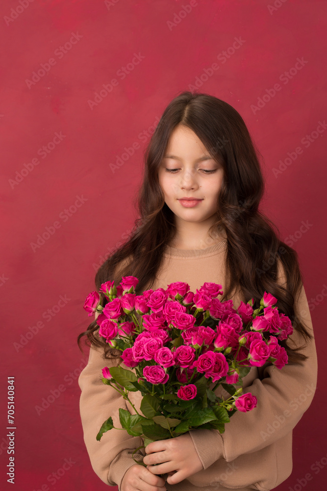 Beautiful girl with a bouquet of small pink roses Beautiful girl with a bouquet of small pink roses