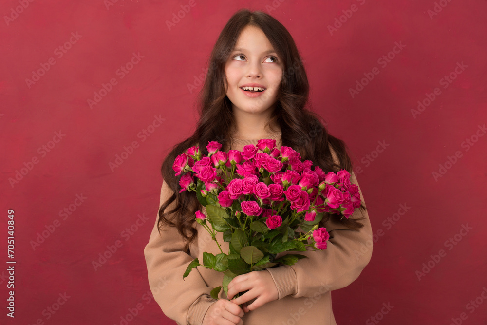 Beautiful girl with a bouquet of small pink roses Beautiful girl with a bouquet of small pink roses