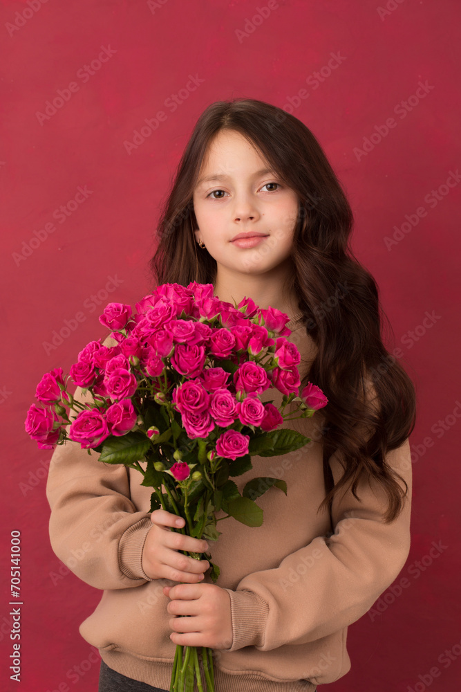 Beautiful girl with a bouquet of small pink roses Beautiful girl with a bouquet of small pink roses