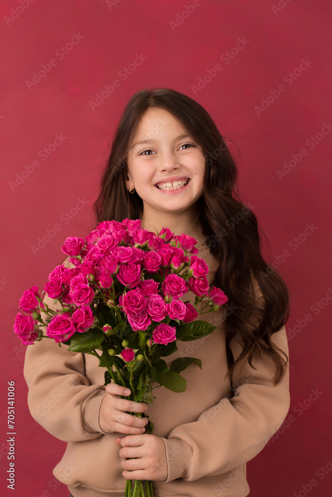 Beautiful girl with a bouquet of small pink roses Beautiful girl with a bouquet of small pink roses