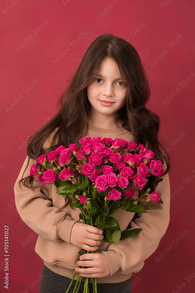 Beautiful girl with a bouquet of small pink roses Beautiful girl with a bouquet of small pink roses