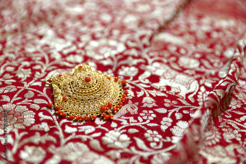 Indian traditional gold Pendant on silk saree