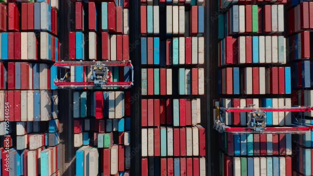 Aerial view container ship carrying container in import export business logistic and transportation. Containers at logistics terminal. Aerial view container ship carrying container in import export business logistic and transportation. Containers at logistics terminal.