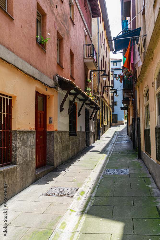 Fototapeta premium The narrow street of the old European city, Portugalete, Basque Country, Spain.