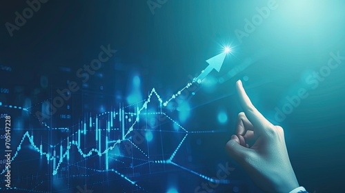 Hand pointing at abstract upward digital chart arrow on blue background. Finance concept photo