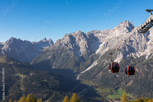 Cable car Tre Cime (Drei Zinnen) with scenic view of ridge summit Dreischusterspitze in majestic mountain range of untamed Sexten Dolomites, South Tyrol, Italy, Europe. Hiking concept Italian Alps