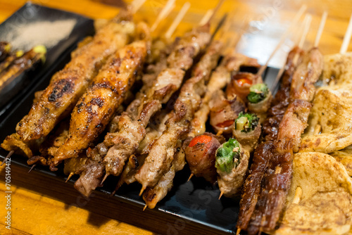Variety of meat skewers on dish