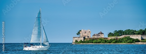 Sailboat on Lake Ontario passing old Fort Niagara photo