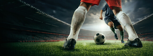 Cropped image of male legs in dirty uniform, football players during game, competing on sport field, 3d outdoor arena. Concept of sport, game, competition, championship. 3D render