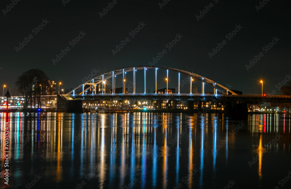 View on the Wilhelmina bridge at the river IJssel near Deventer in the Netherlands by night