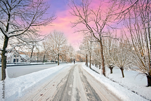 Snowy landscape in winter in the Netherlands at sunset © Nataraj